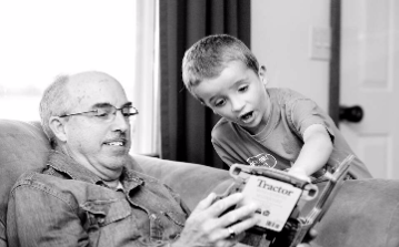 Black and white photo of a grandparent with grandchild